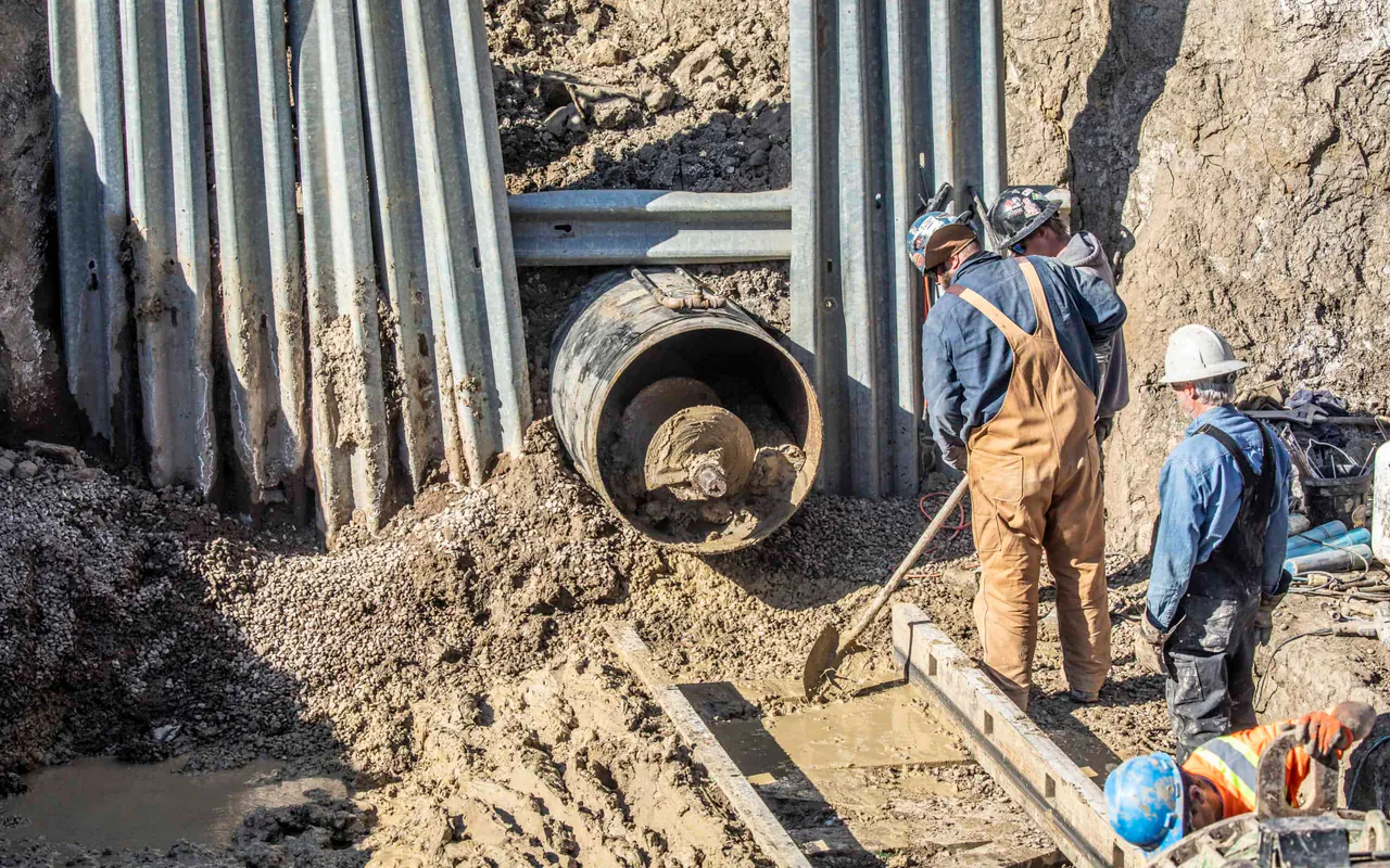 Large steel casing and Syncore crew working on a trenchless crossing